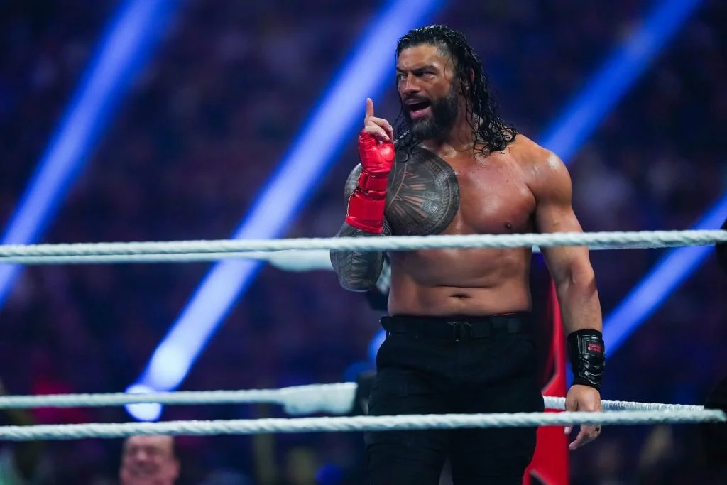  Roman Reigns looks on during the WWE and Universal Championship match 