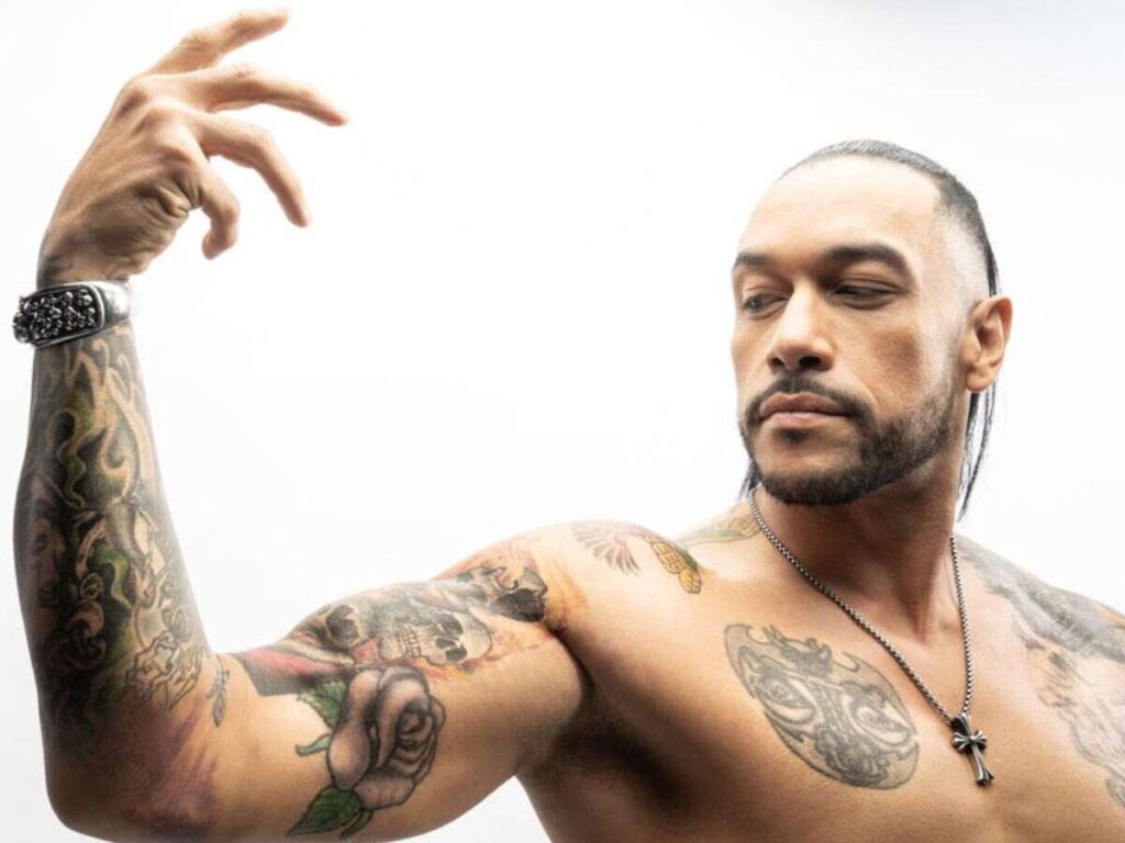 Damien Priest showcasing his Tattoos